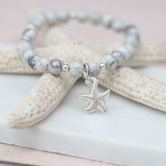 Howlite beaded bracelet with fine silver charm