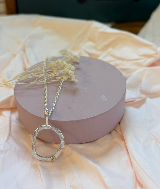 Organic circle necklace in sterling silver with a 9ct gold nugget