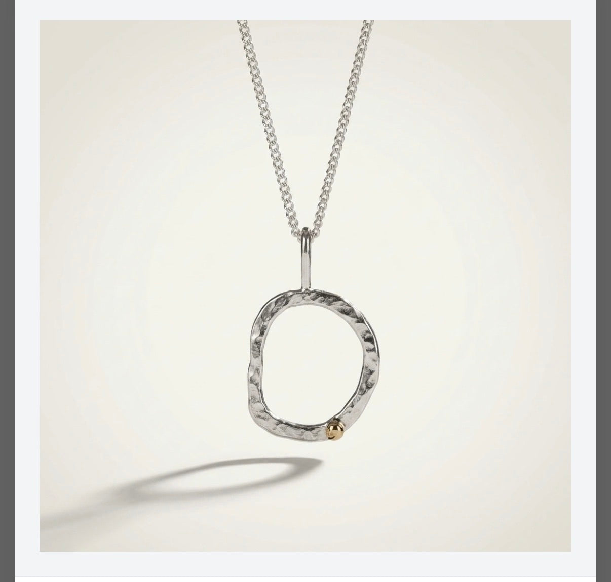 Organic circle necklace in sterling silver with a 9ct gold nugget